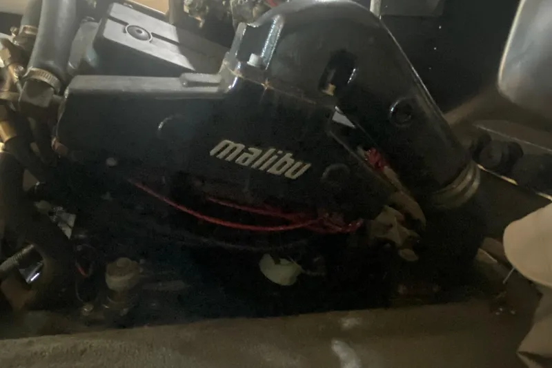 Slide: The Image of 1998 Malibu Sportster engine with visible components and branding. - 9