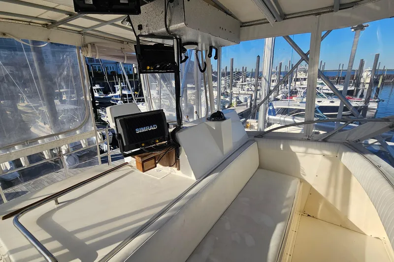 Slide: The Image of 1980 Bertram 42 Convertible boat interior with navigation equipment at marina. - 32