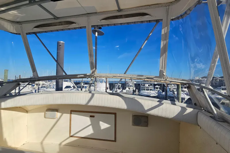 Slide: The Image of Interior view of a 1980 Bertram 42 Convertible yacht at a marina. - 34