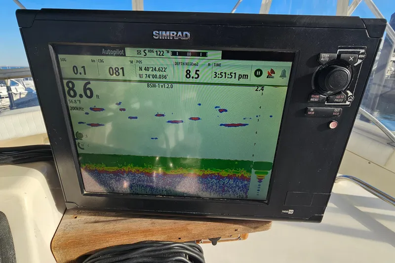 Slide: The Image of Simrad marine display on 1980 Bertram 42 Convertible showing sonar and navigation data. - 37