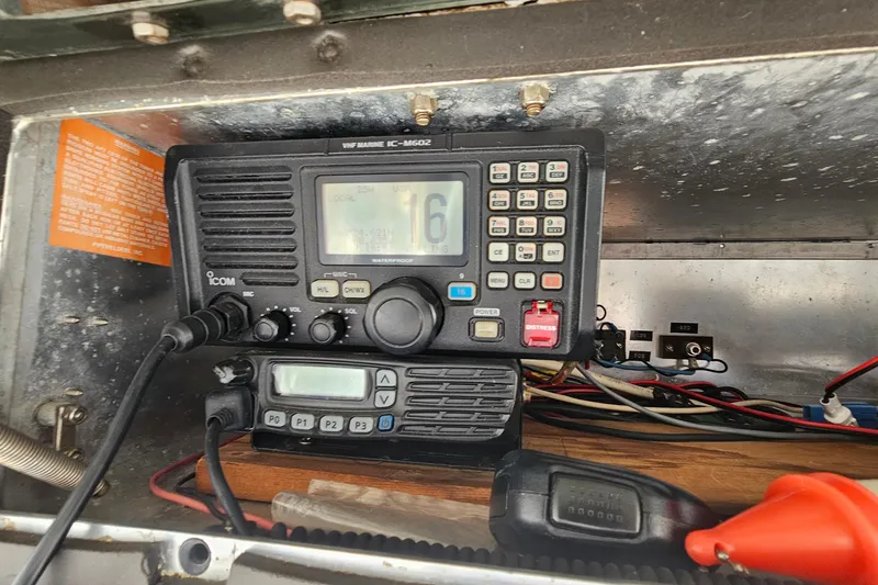 Slide: The Image of VHF marine radio equipment inside a 1980 Bertram 42 Convertible boat. - 41
