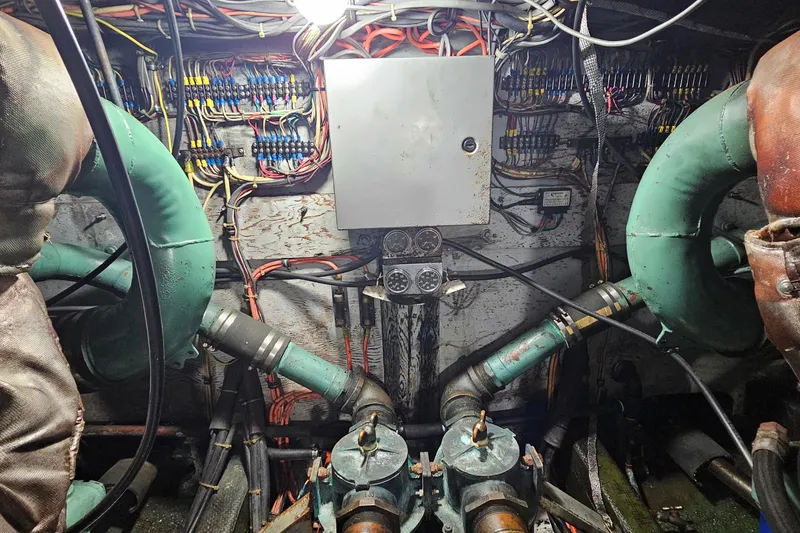 Slide: The Image of Engine room of a 1980 Bertram 42 Convertible with wiring and machinery. - 45
