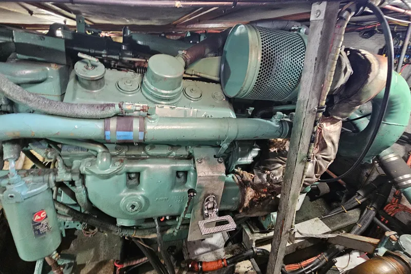 Slide: The Image of Engine of a 1980 Bertram 42 Convertible boat, showcasing mechanical components. - 47
