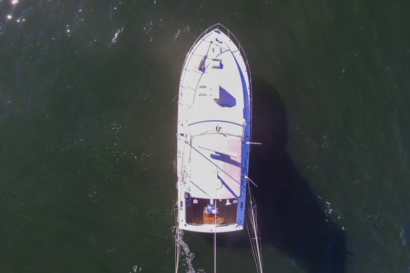Slide: The Image of Aerial view of 1980 Bertram 42 Convertible yacht on open water. - 9