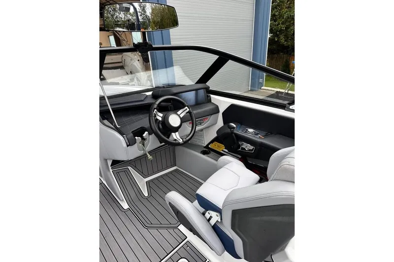 Slide: The Image of 2023 Nautique Super Air Nautique G23 Paragon cockpit with sleek design and modern controls. - 5