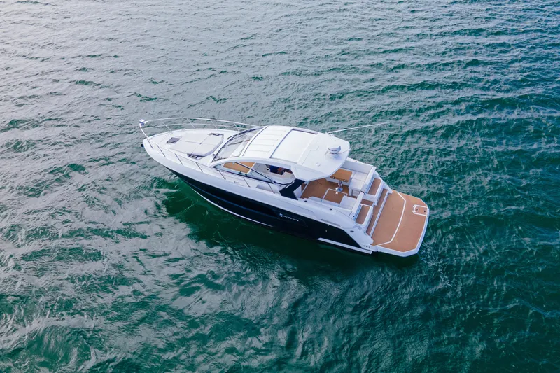 Slide: The Image of 2018 Cruisers Yachts 390 Express Coupe on open water, aerial view. - 11