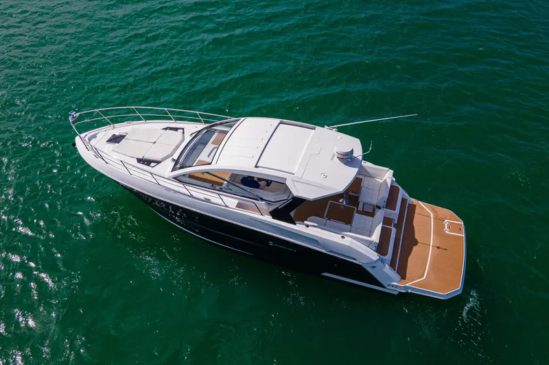 Slide: The Image of 2018 Cruisers Yachts 390 Express Coupe on open water, aerial view. - 12