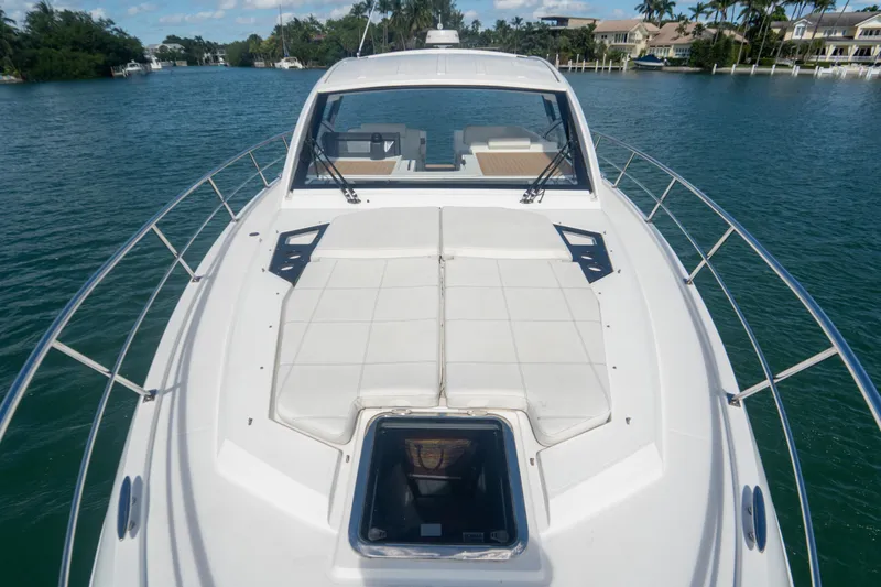 Slide: The Image of 2018 Cruisers Yachts 390 Express Coupe bow view with sunpad and railing. - 47