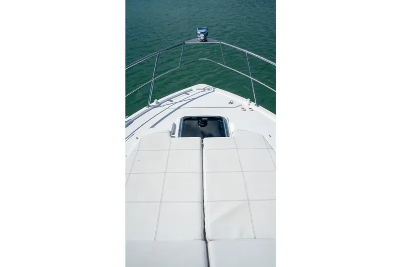 Slide: The Image of 2018 Cruisers Yachts 390 Express Coupe with "Here Be Dragons" text, Mercer Island, WA. - 48