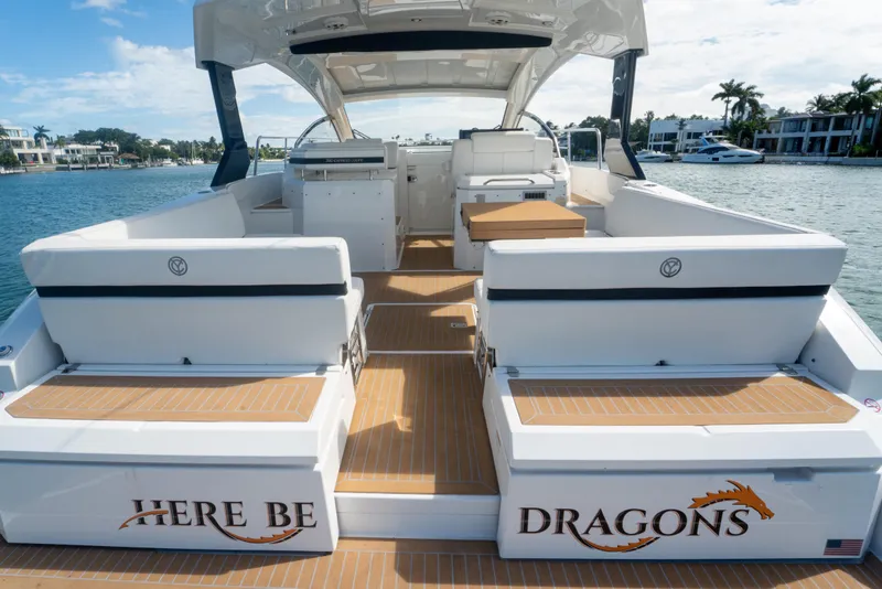 Slide: The Image of 2018 Cruisers Yachts 390 Express Coupe kitchen interior with modern appliances and wood cabinetry. - 56