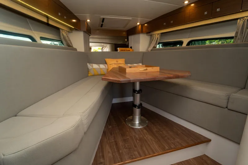 Slide: The Image of 2018 Cruisers Yachts 390 Express Coupe interior with kitchen and dining area. - 58