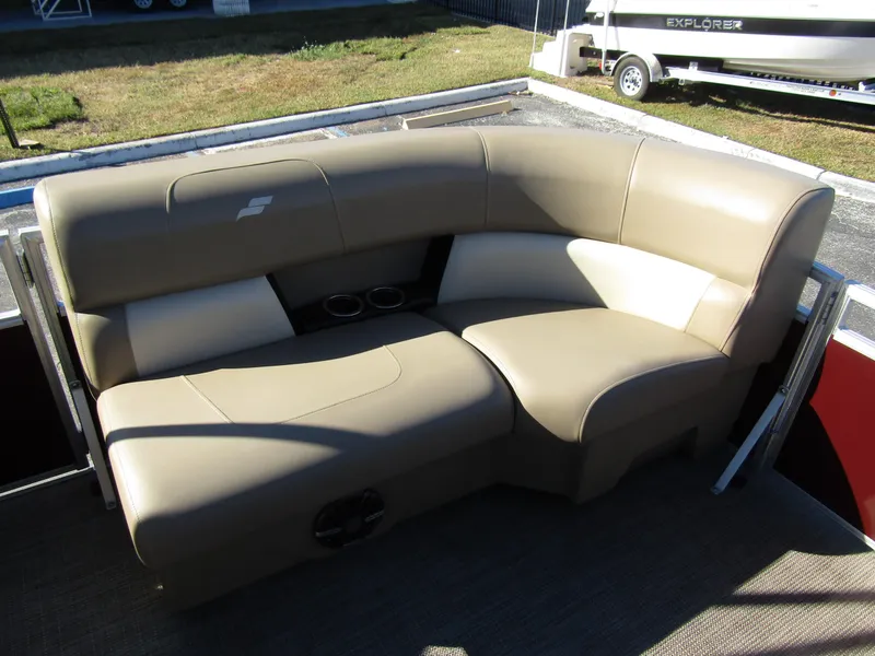 Slide: The Image of 2024 Starcraft LX 20 R boat seating with beige upholstery and cup holders. - 8