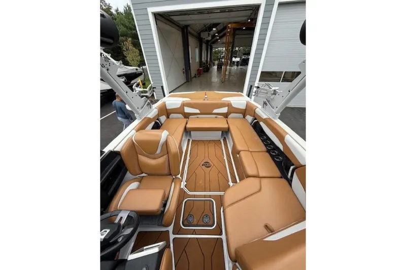 Slide: The Image of 2022 Malibu Wakesetter 22 LSV interior with tan leather seating and modern design. - 4
