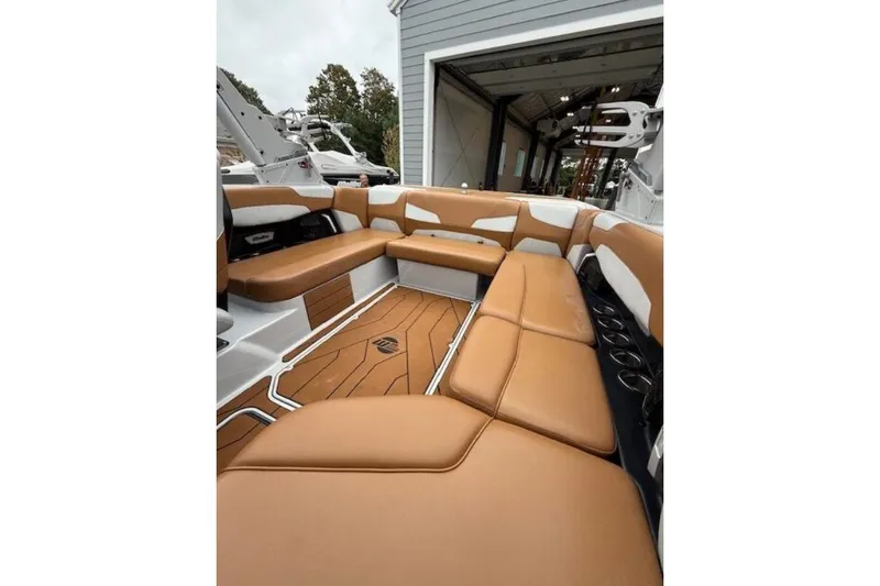 Slide: The Image of 2022 Malibu Wakesetter 22 LSV interior with tan leather seating and modern design. - 5
