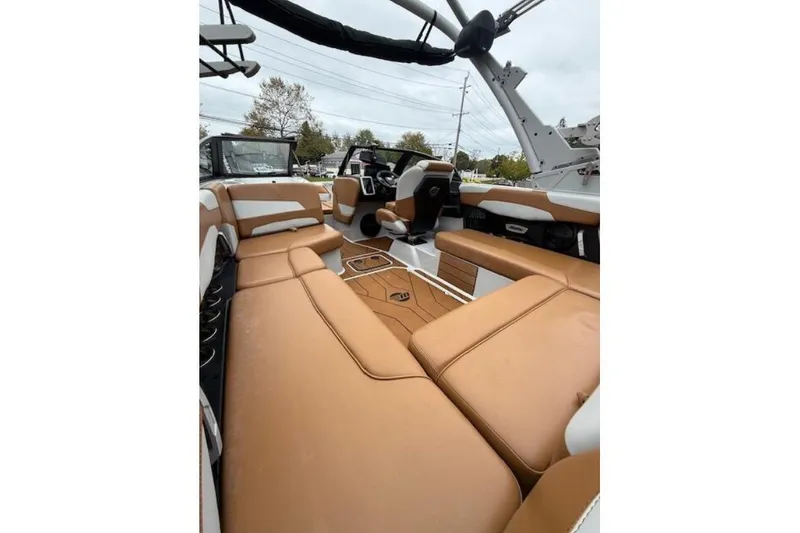 Slide: The Image of 2022 Malibu Wakesetter 22 LSV interior with tan seating and modern design. - 8