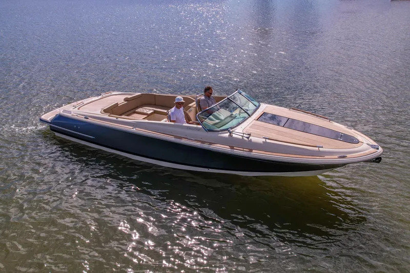 The Image of 2017 Chris-Craft Corsair 28 Heritage Edition boat cruising on calm water. - 0