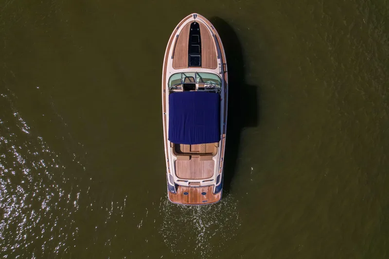 Slide: The Image of Aerial view of 2017 Chris-Craft Corsair 28 Heritage Edition boat on water. - 16