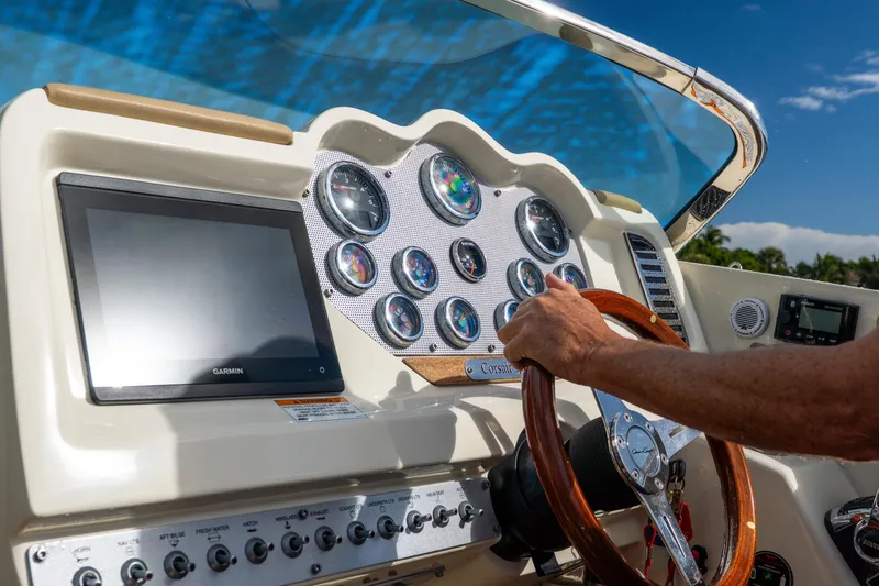 Slide: The Image of 2017 Chris-Craft Corsair 28 Heritage Edition dashboard with gauges and steering wheel. - 29