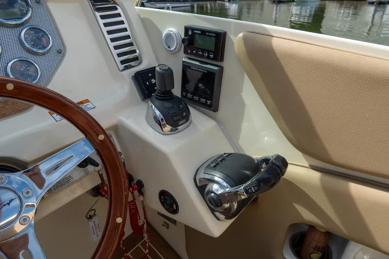 Slide: The Image of 2017 Chris-Craft Corsair 28 Heritage Edition dashboard with controls and steering wheel. - 34