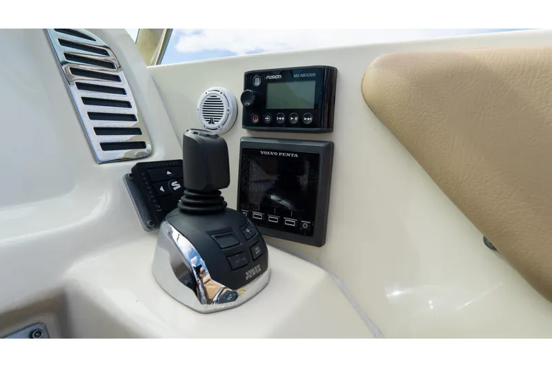 Slide: The Image of Control panel of 2017 Chris-Craft Corsair 28 Heritage Edition with joystick and audio system. - 36