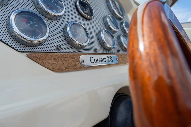 Slide: The Image of Dashboard of 2017 Chris-Craft Corsair 28 Heritage Edition with wooden steering wheel. - 38