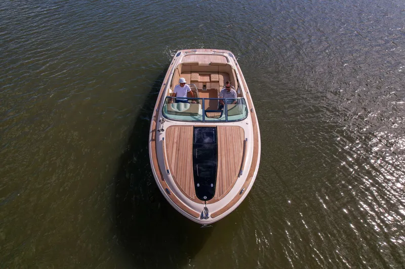 Slide: The Image of 2017 Chris-Craft Corsair 28 Heritage Edition boat cruising on calm waters. - 4