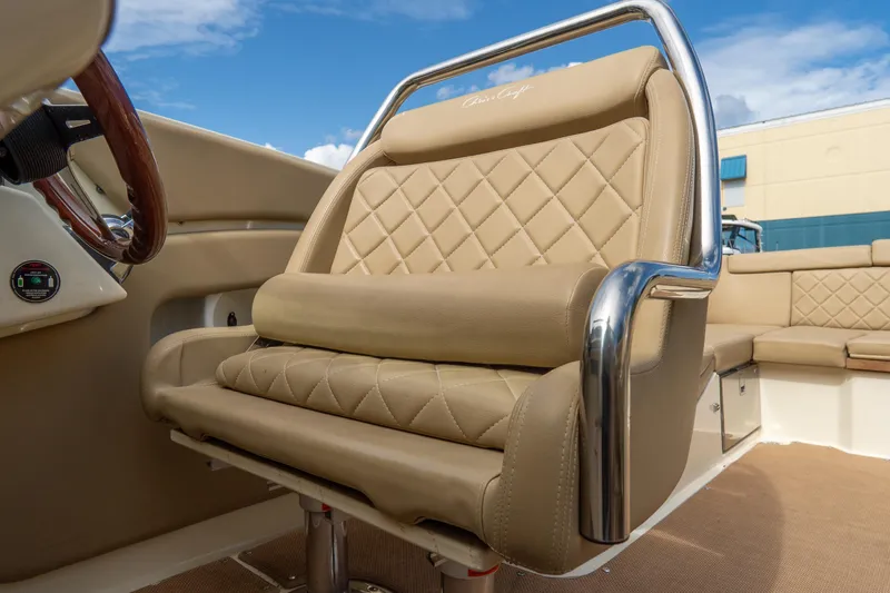 Slide: The Image of Luxurious seating on 2017 Chris-Craft Corsair 28 Heritage Edition boat, featuring tan leather upholstery. - 41