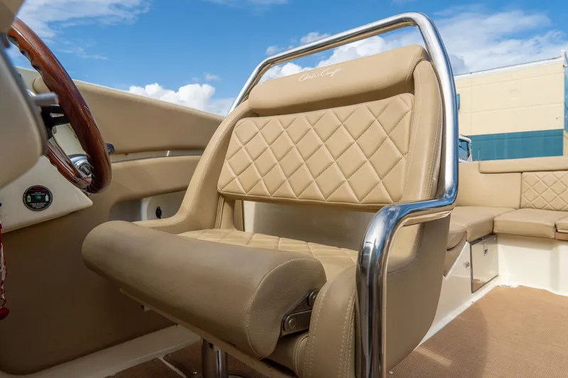 Slide: The Image of Luxurious interior of 2017 Chris-Craft Corsair 28 Heritage Edition boat with beige leather seating. - 42