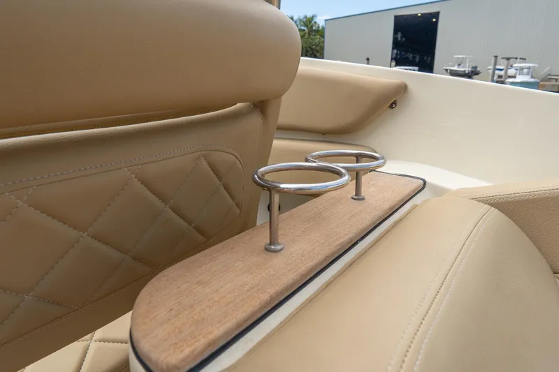 Slide: The Image of 2017 Chris-Craft Corsair 28 Heritage Edition interior with tan leather seats and cup holders. - 44