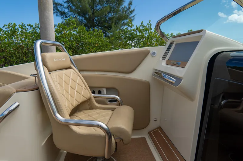 Slide: The Image of Luxurious interior of 2017 Chris-Craft Corsair 28 Heritage Edition boat with beige seating. - 45