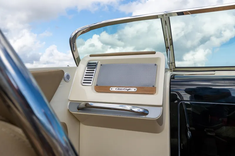 Slide: The Image of 2017 Chris-Craft Corsair 28 Heritage Edition dashboard with speaker and chrome accents. - 49