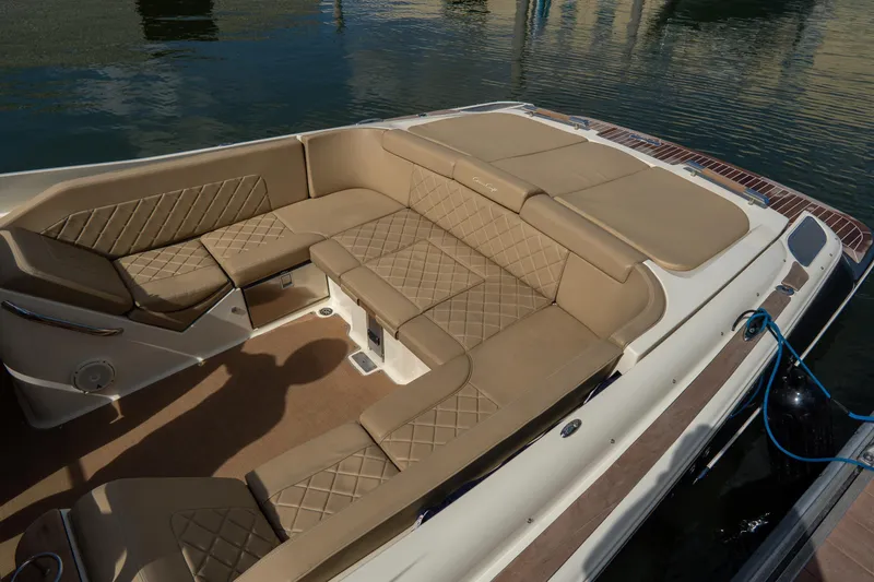 Slide: The Image of 2017 Chris-Craft Corsair 28 Heritage Edition boat with luxurious tan seating and elegant design. - 55