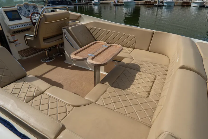 Slide: The Image of Luxurious interior of 2017 Chris-Craft Corsair 28 Heritage Edition boat with tan leather seating. - 57