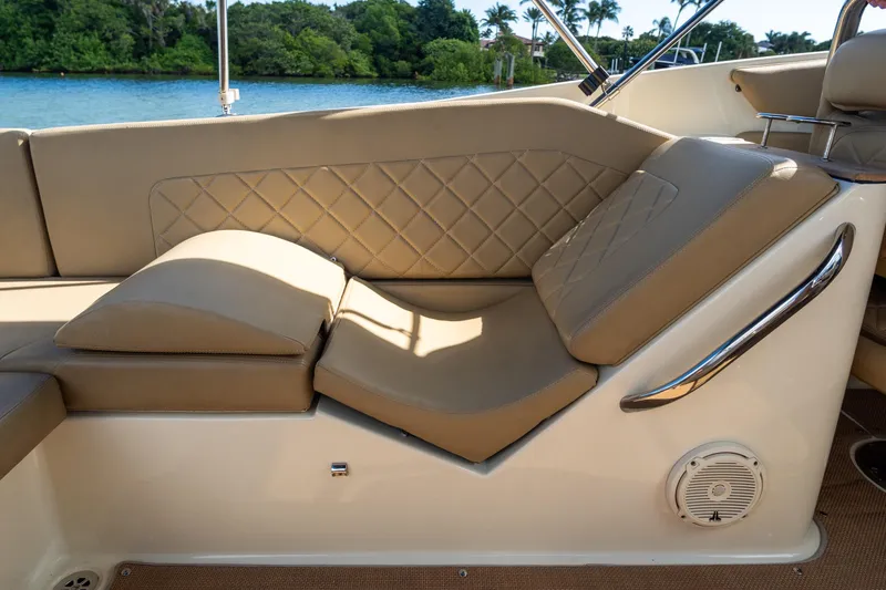 Slide: The Image of 2017 Chris-Craft Corsair 28 Heritage Edition interior with tan leather seating and quilted design. - 61
