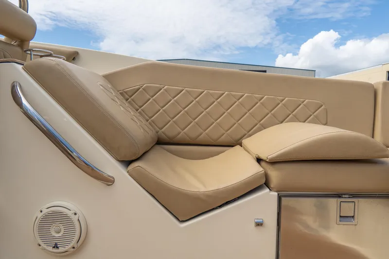 Slide: The Image of Luxurious seating on 2017 Chris-Craft Corsair 28 Heritage Edition boat under blue sky. - 63