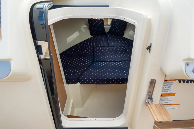 Slide: The Image of 2017 Chris-Craft Corsair 28 Heritage Edition cabin interior with polka dot cushions. - 66