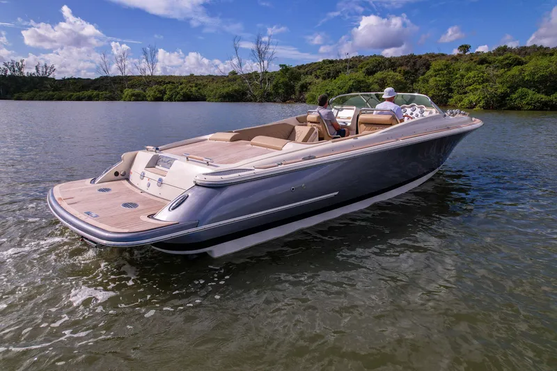 Slide: The Image of 2017 Chris-Craft Corsair 28 Heritage Edition cruising on a scenic waterway. - 7