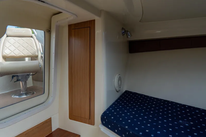 Slide: The Image of Interior cabin of 2017 Chris-Craft Corsair 28 Heritage Edition with seating and bed. - 72