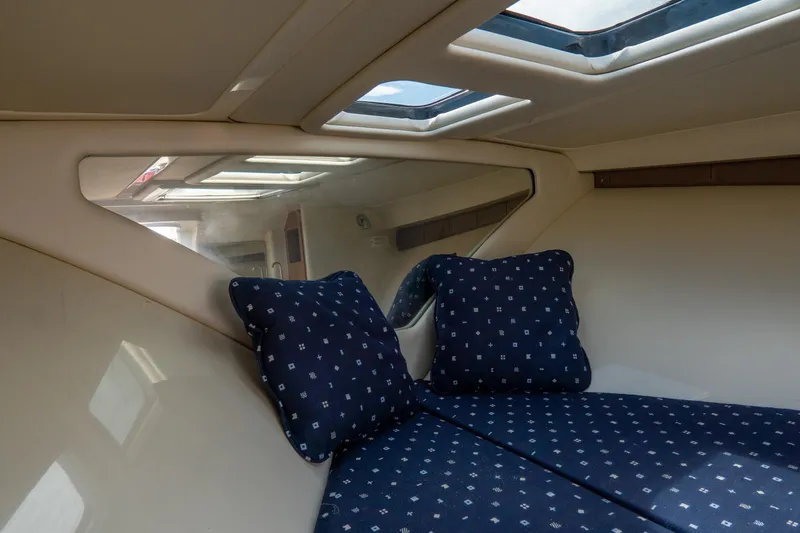 Slide: The Image of Interior cabin of 2017 Chris-Craft Corsair 28 Heritage Edition with skylight and blue cushions. - 73