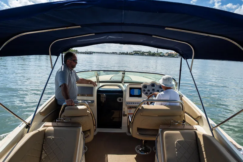 Slide: The Image of 2017 Chris-Craft Corsair 28 Heritage Edition cruising on a sunny day with two passengers. - 76