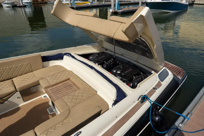 Slide: The Image of 2017 Chris-Craft Corsair 28 Heritage Edition boat with open engine compartment at marina. - 79