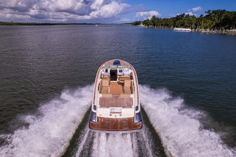 Slide: The Image of 2017 Chris-Craft Corsair 28 Heritage Edition cruising on a scenic waterway. - 8