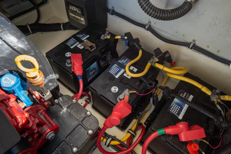 Slide: The Image of Engine compartment of 2017 Chris-Craft Corsair 28 Heritage Edition with batteries and wiring. - 82