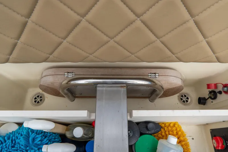 Slide: The Image of Interior storage of 2017 Chris-Craft Corsair 28 Heritage Edition with cleaning supplies. - 85