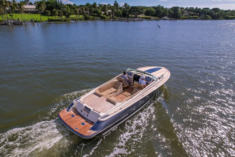 Slide: The Image of 2017 Chris-Craft Corsair 28 Heritage Edition cruising on a scenic waterway. - 88