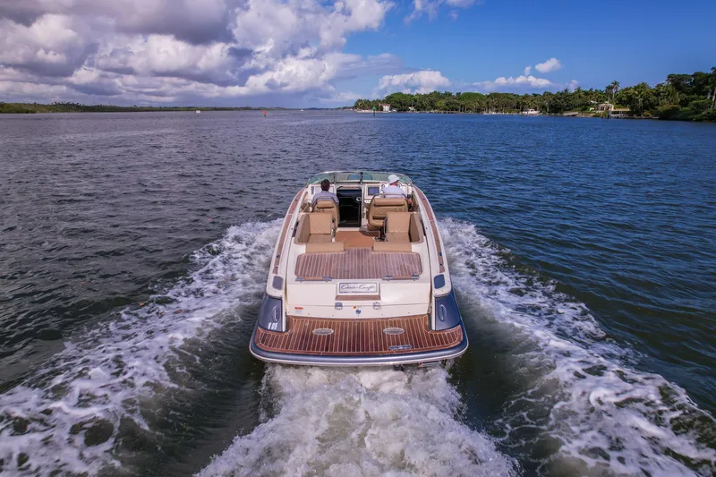 Slide: The Image of 2017 Chris-Craft Corsair 28 Heritage Edition cruising on a scenic waterway. - 89