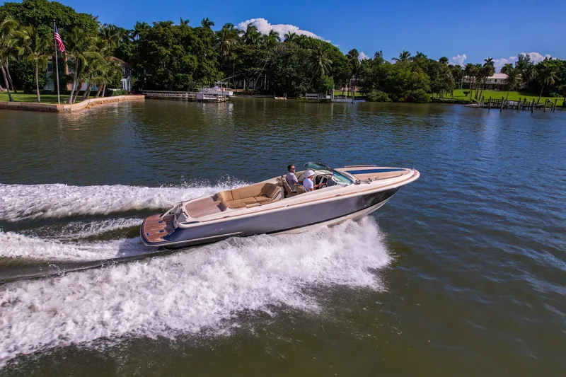 Slide: The Image of 2017 Chris-Craft Corsair 28 Heritage Edition cruising on a scenic waterway. - 9
