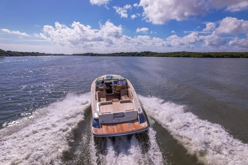 Slide: The Image of 2017 Chris-Craft Corsair 28 Heritage Edition cruising on a scenic waterway. - 91