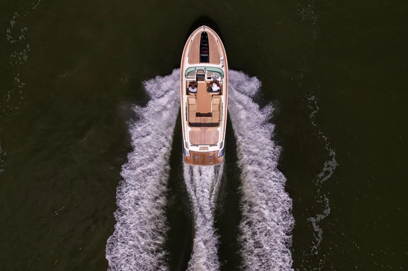 Slide: The Image of Aerial view of 2017 Chris-Craft Corsair 28 Heritage Edition cruising on water. - 92