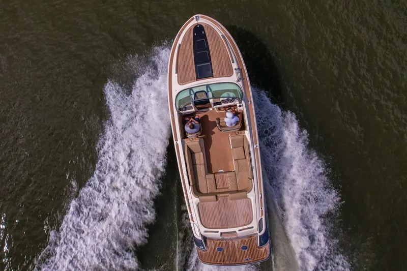 Slide: The Image of 2017 Chris-Craft Corsair 28 Heritage Edition cruising on water, aerial view. - 93